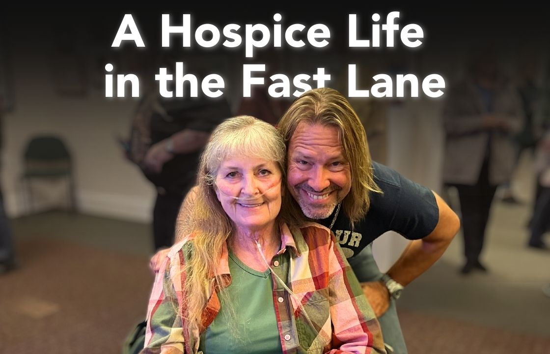 Phyllis, a Hospice of the Piedmont patient, poses with a member of "On The Border - The Ultimate Eagles Tribute"