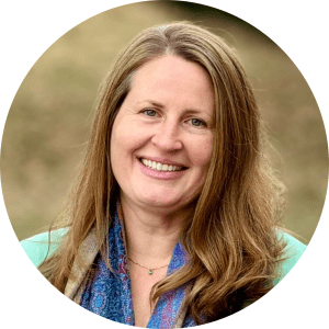Hospice of the Piedmont Development Officer Ophelia Lenz wears a light green top and a colorful blue scarf
