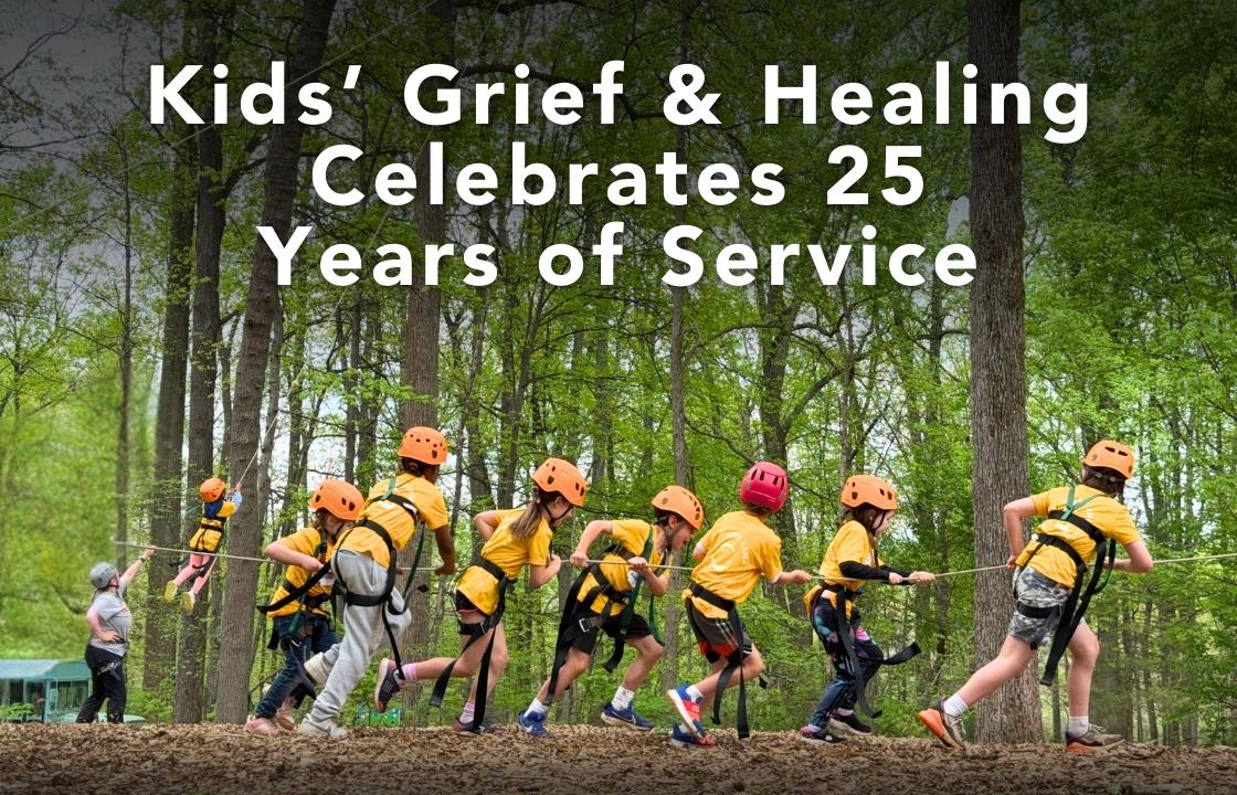 a group of children in bright yellow t-shirts pulls a rope to launch a fellow camper into the sky